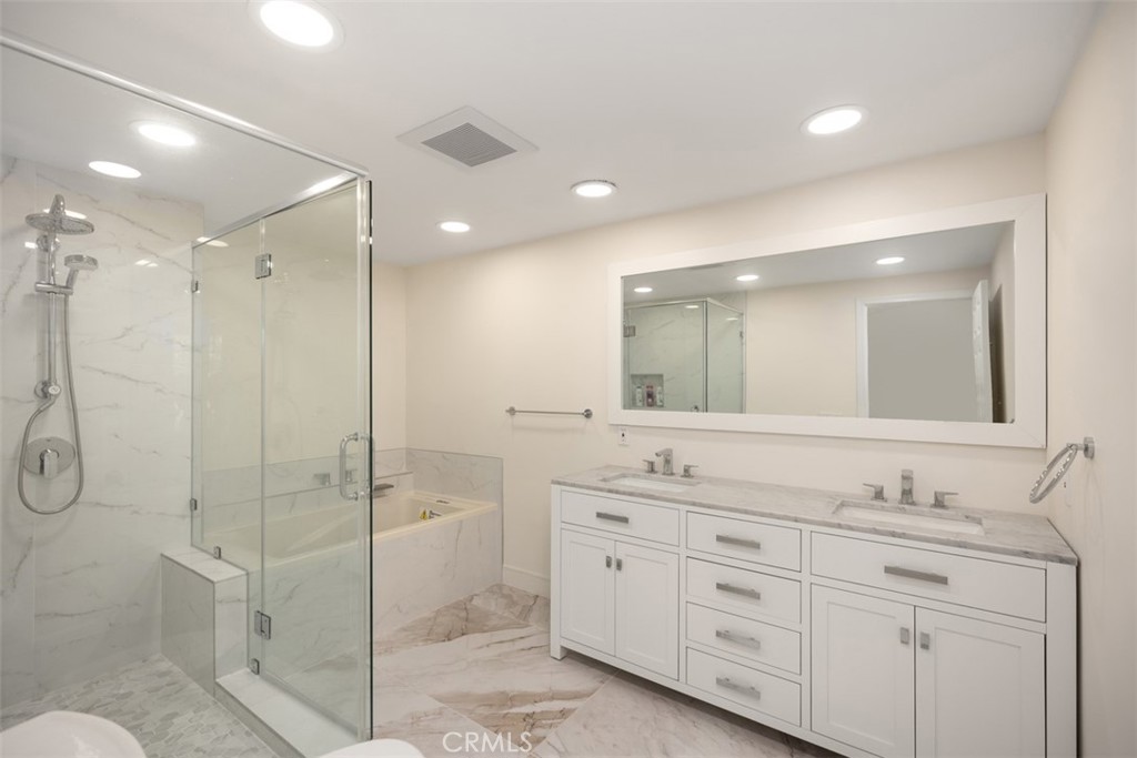 21322 Calle Balsa Lake Forest, CA 92630 - Photo 33 of 45 a bathroom with a double vanity sink mirror double and shower