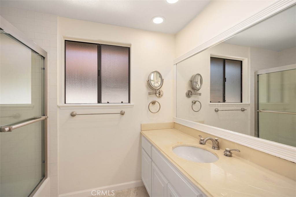 21322 Calle Balsa Lake Forest, CA 92630 - Photo 36 of 45 a bathroom with a tub a sink and mirror