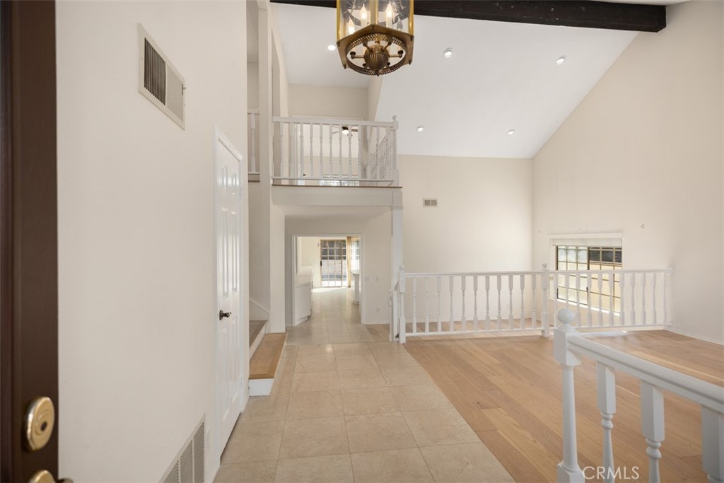 21322 Calle Balsa Lake Forest, CA 92630 - Photo 5 of 45 a view of entryway and hall with wooden floor