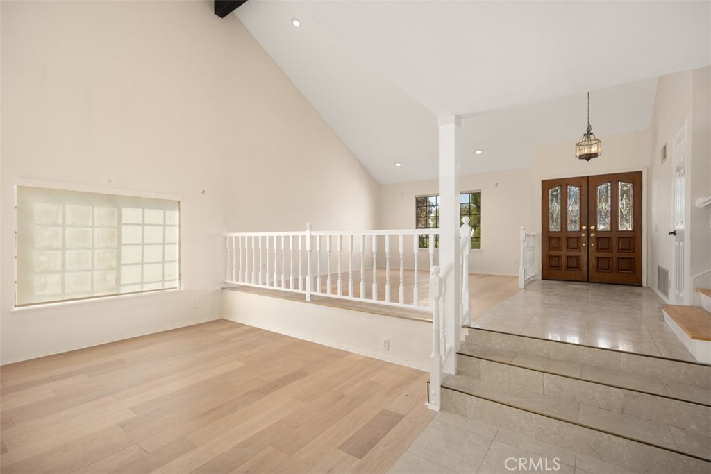 21322 Calle Balsa Lake Forest, CA 92630 - Photo 7 of 45 an entryway with wooden floor and windows