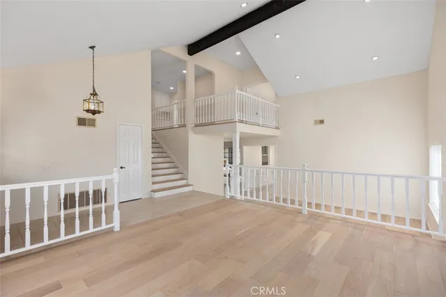 a view of a hallway with stairs