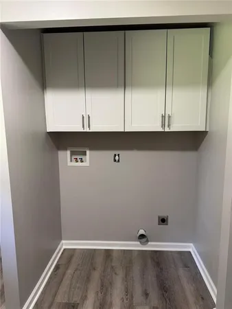 a view of room with wooden floor