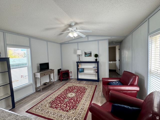 972 Ridgeway Loop, Unit 228 Garden City, UT 84028 - Photo 7 of 26 Living area featuring healthy amount of natural light, a ceiling fan