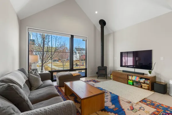 a living room with furniture and kitchen view