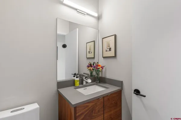a view of a sink with washer and dryer