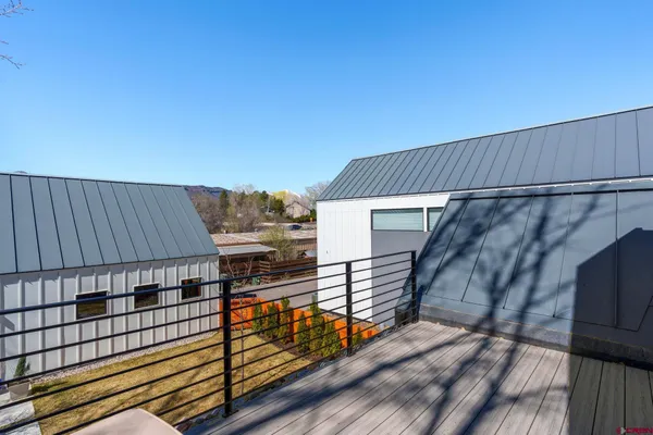 a living room with patio furniture and a fireplace