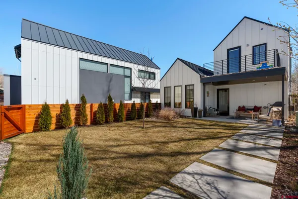a view of a house with snow on the road