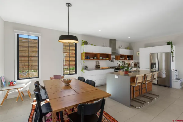 a view of a dining room with furniture and window