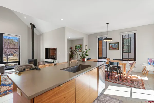 a kitchen with sink cabinets and refrigerator