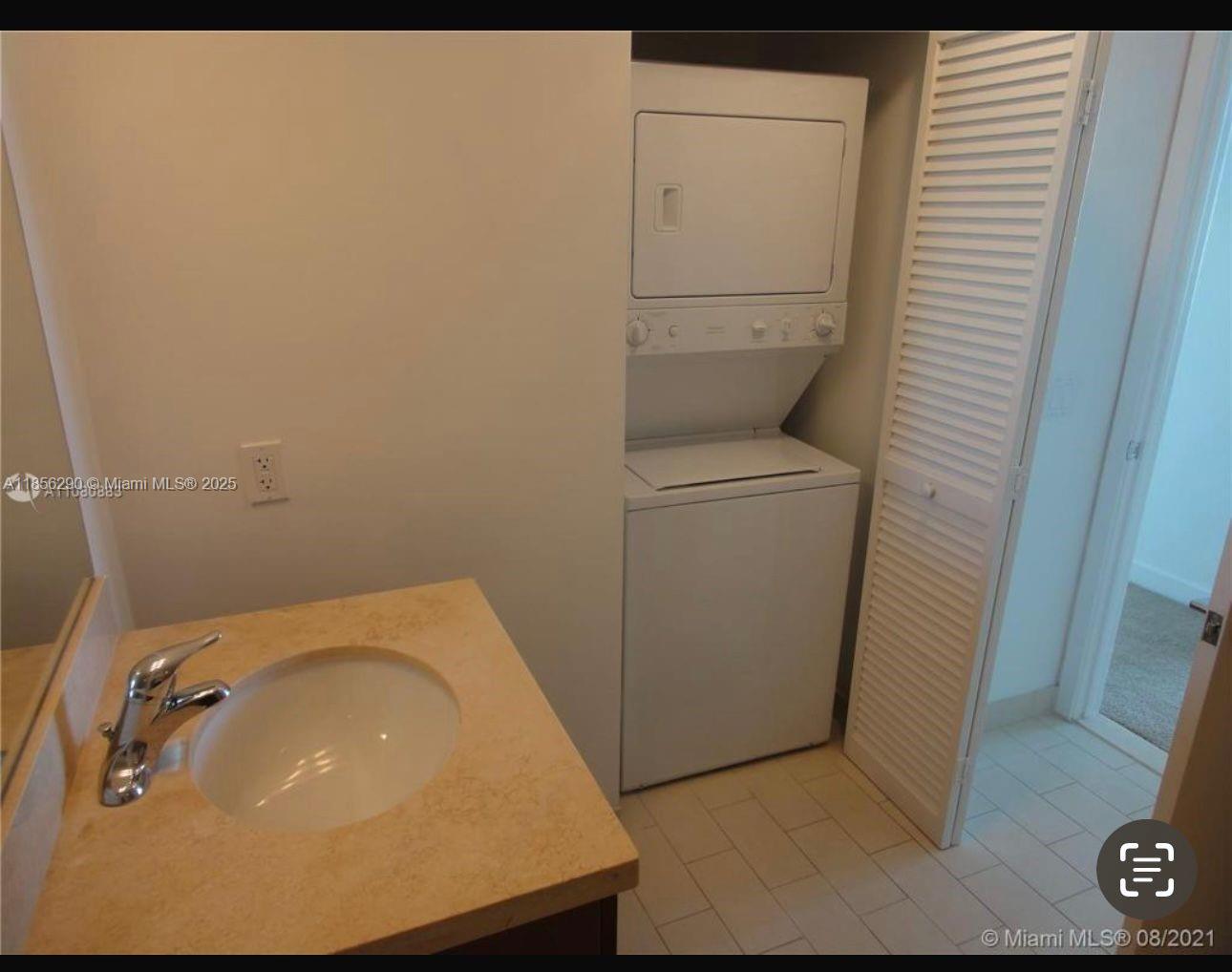 1111 Southwest 1st Avenue, Unit 3122N Miami, FL 33130 - Photo 4 of 9 a bathroom with a sink and toilet