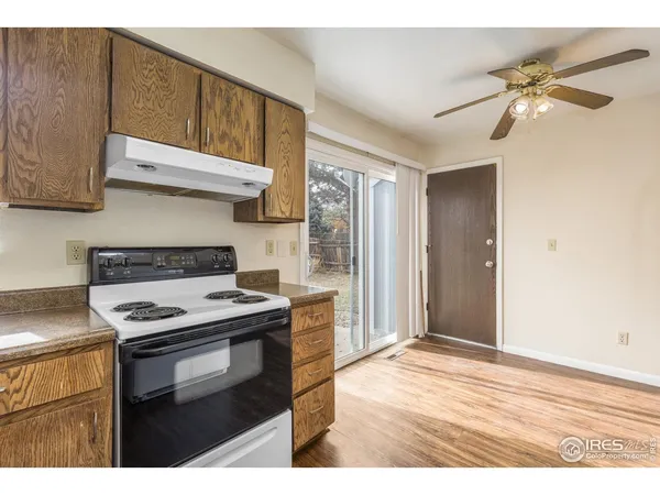a kitchen with a stove and a microwave