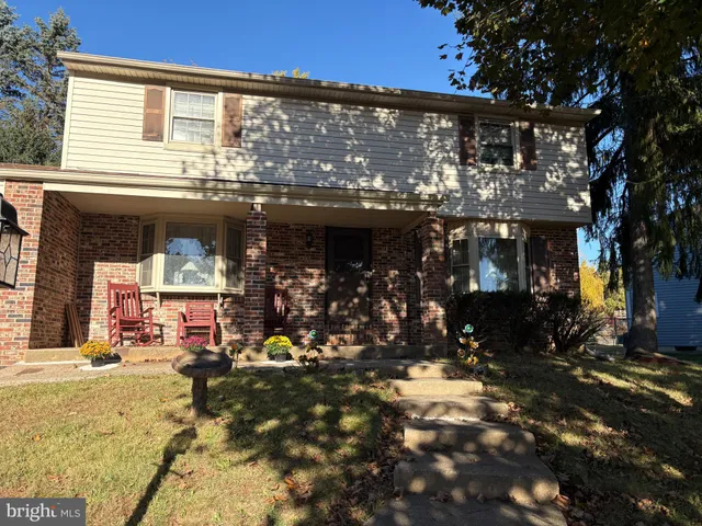 a view of a house with a tree