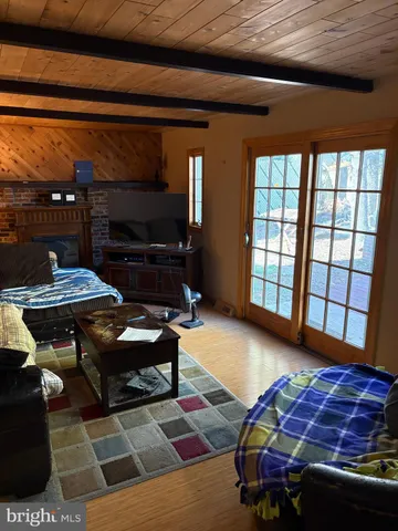 a outdoor dining space with furniture and window