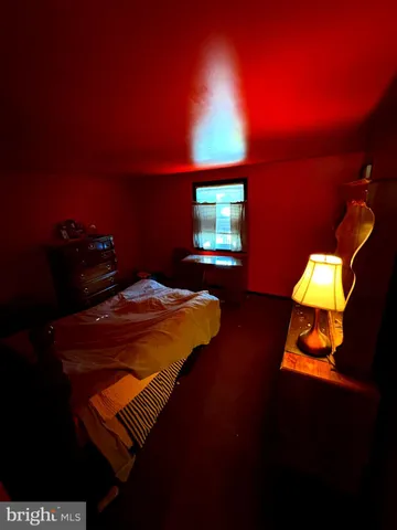 a bedroom with a bed and a table in it