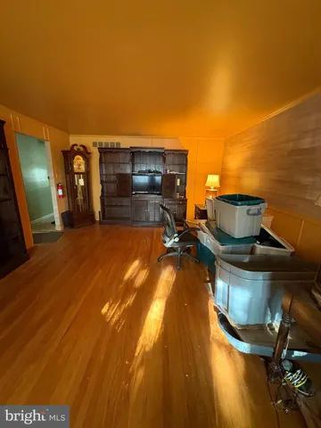 a view of a livingroom with furniture and wooden floor