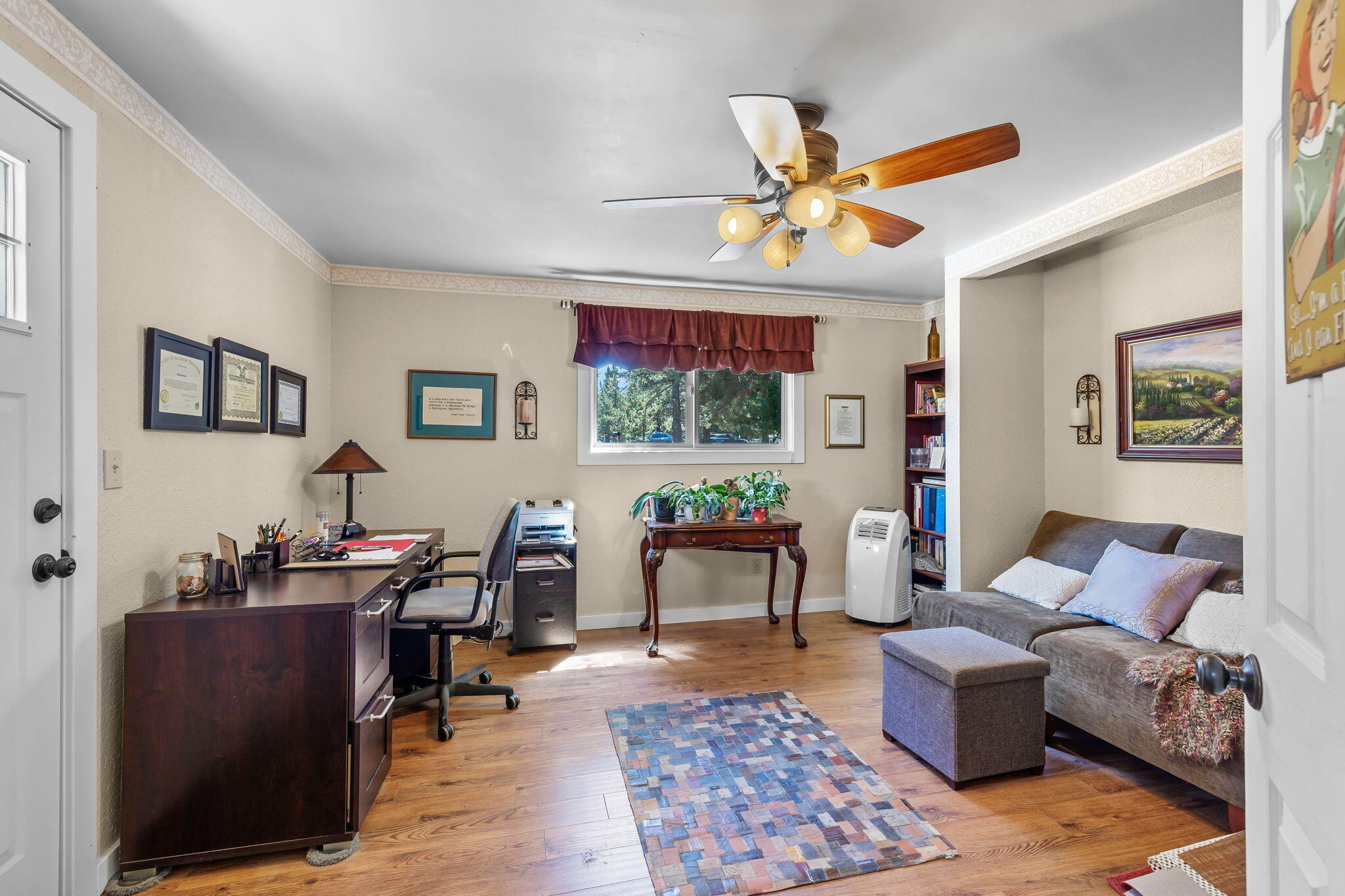 21870 Rincon Avenue Bend, OR 97702 - Photo 18 of 47 . Also found on the main level is a guest bedroom with private entry that makes it an ideal home office.