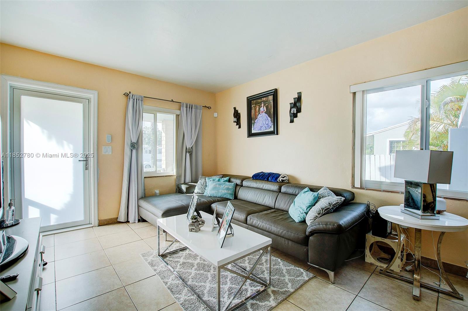 1721 Southwest 75th Avenue Road Miami, FL 33155 - Photo 3 of 13 a living room with furniture and a window