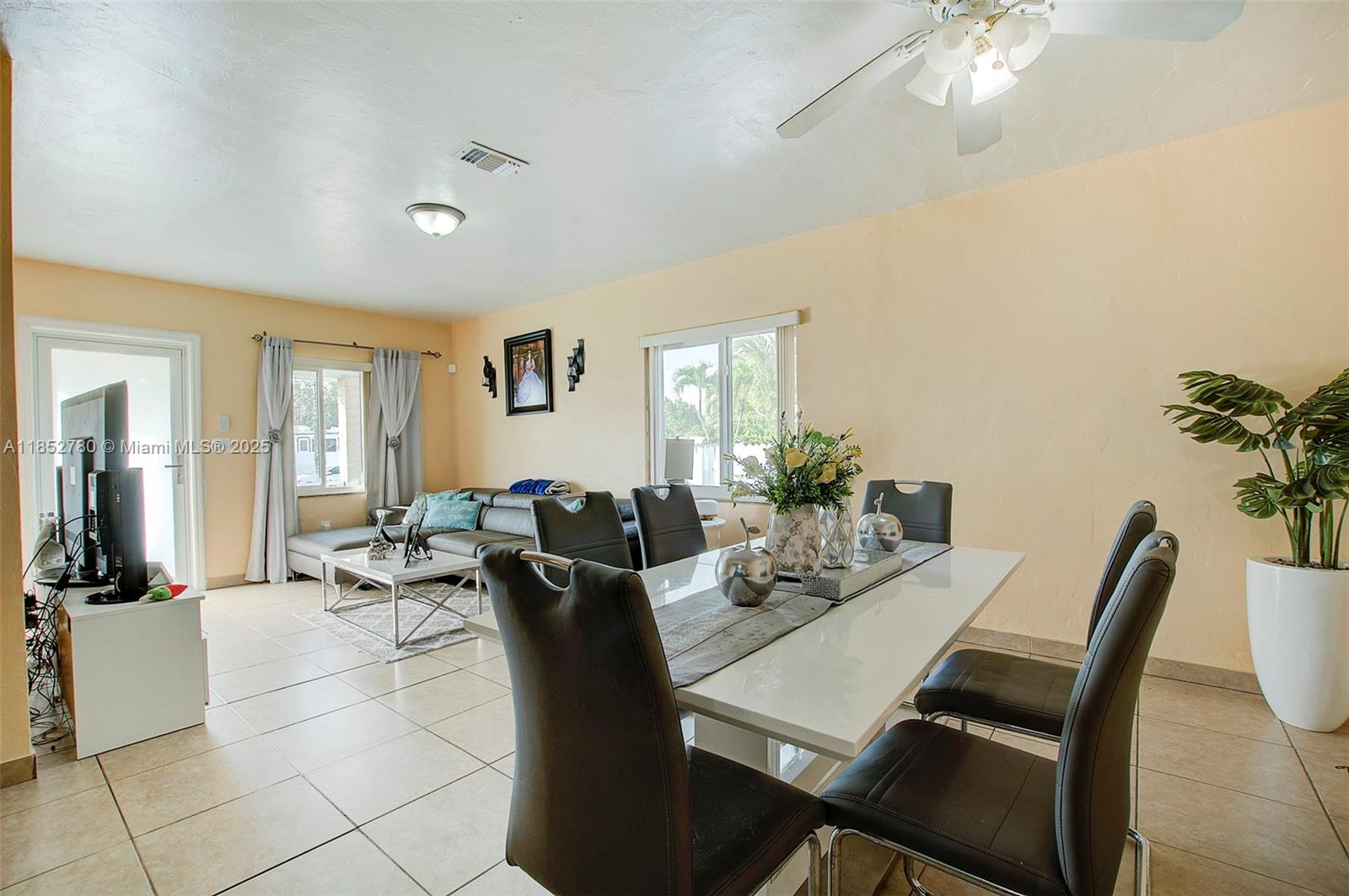 1721 Southwest 75th Avenue Road Miami, FL 33155 - Photo 4 of 13 a view of a dining room with furniture