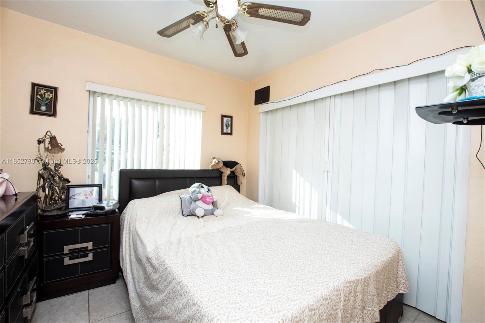 1721 Southwest 75th Avenue Road Miami, FL 33155 - Photo 6 of 13 a bedroom with a bed and wooden floor
