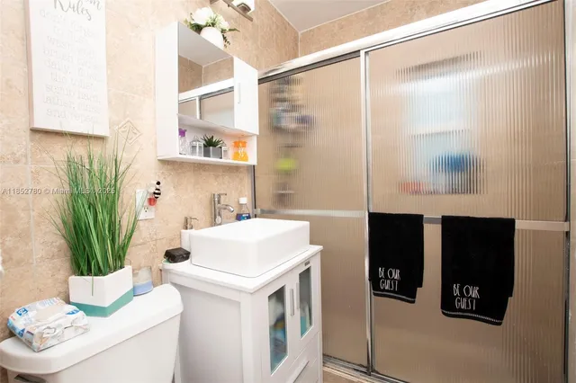 a utility room with sink dryer and washer