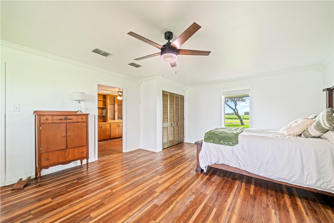 501 South County Road 1140 Riviera, TX 78379 - Photo 22 of 40 Expansive first-floor primary suite featuring wood
