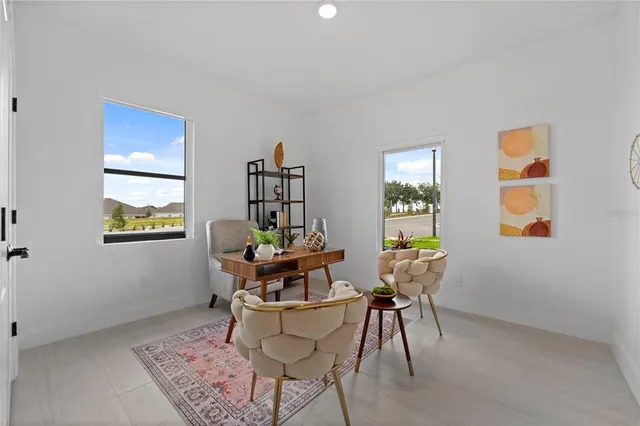 a dining room with furniture and window