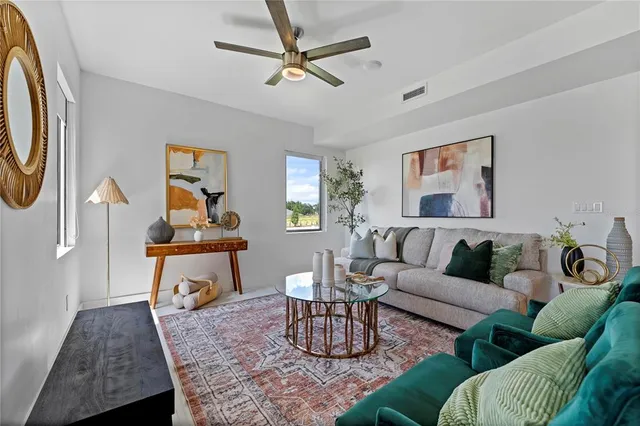 a living room with furniture and a rug