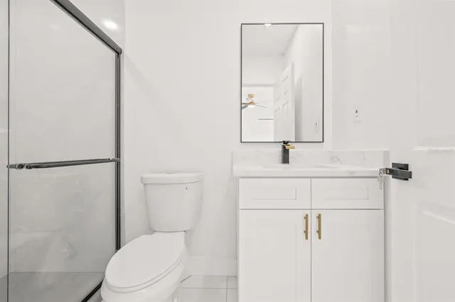a bathroom with a toilet sink and shower