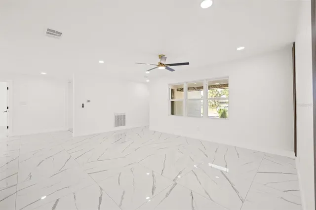 a view of an empty room with a window