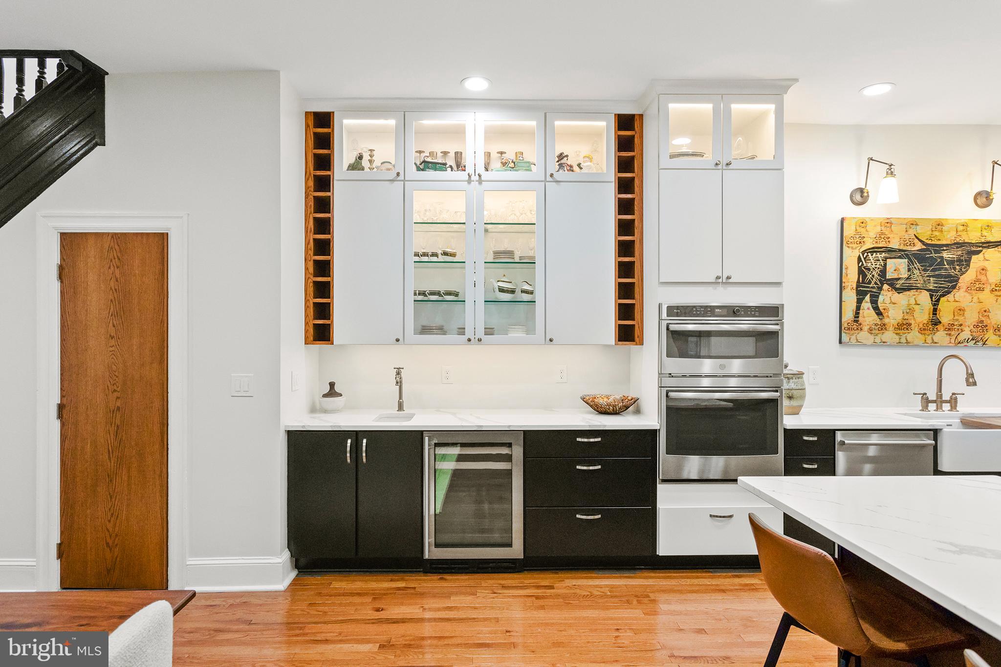 36 Quincy Place Northeast Washington, DC 20002 - Photo 11 of 29 a kitchen with stainless steel appliances granite countertop a stove a sink dishwasher and a refrigerator with wooden floor