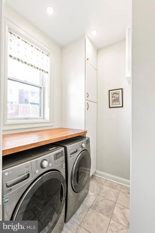 a view of a room that has a washer and dryer in it