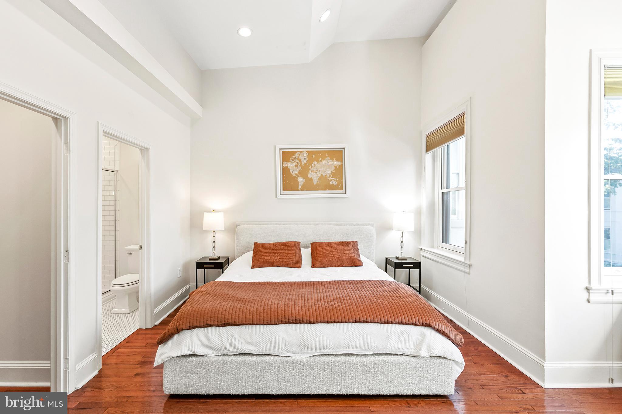 36 Quincy Place Northeast Washington, DC 20002 - Photo 15 of 29 a bedroom with a bed and wooden floor