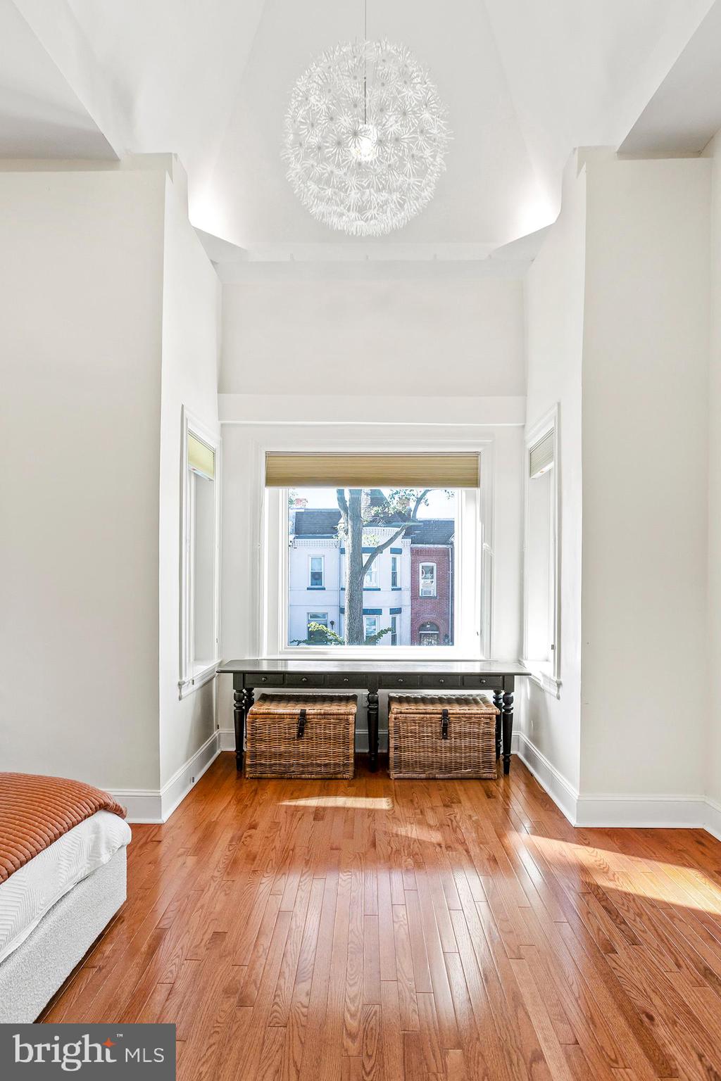36 Quincy Place Northeast Washington, DC 20002 - Photo 16 of 29 a view of an empty room with wooden floor and a window