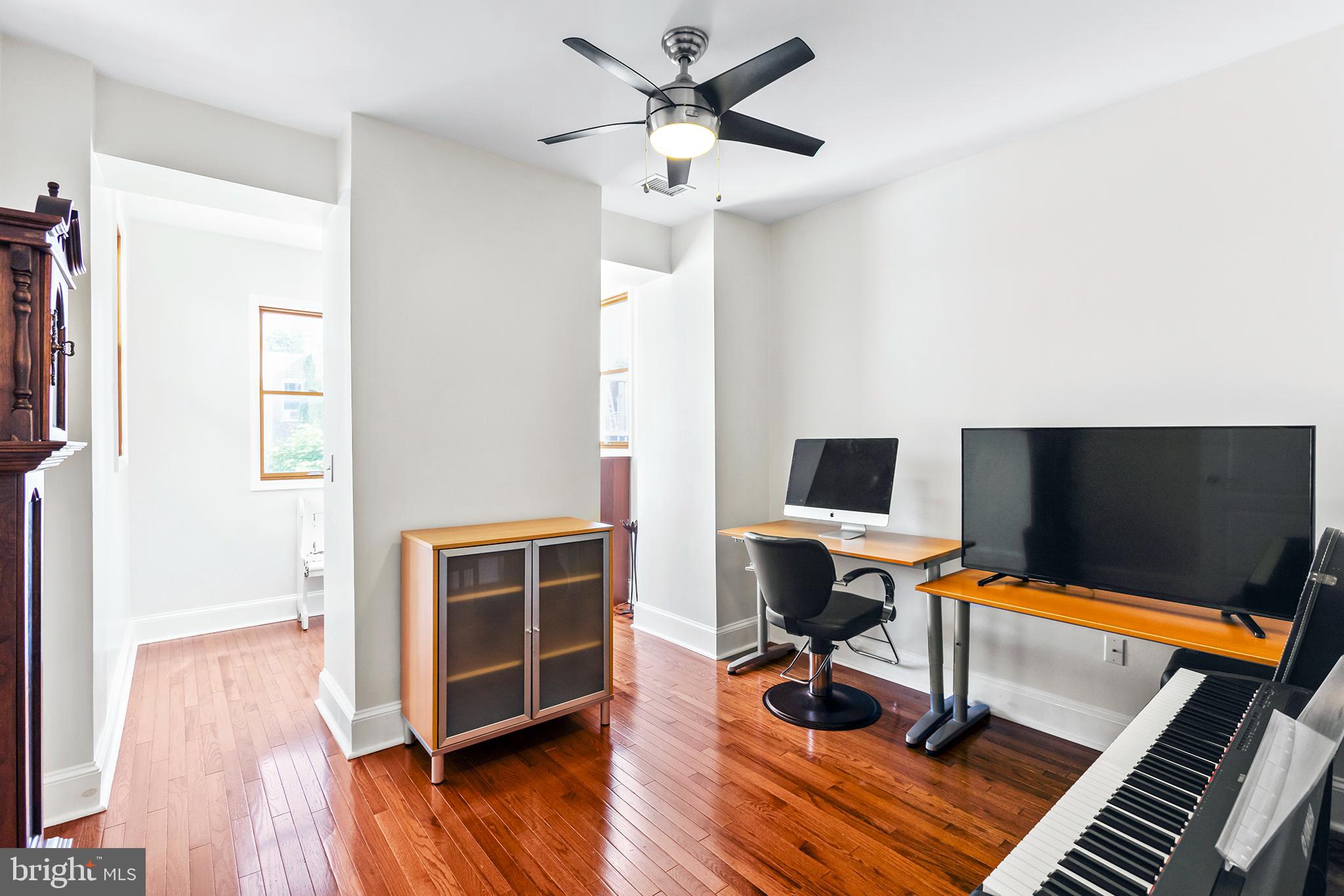 36 Quincy Place Northeast Washington, DC 20002 - Photo 18 of 29 a workspace with furniture and a ceiling fan