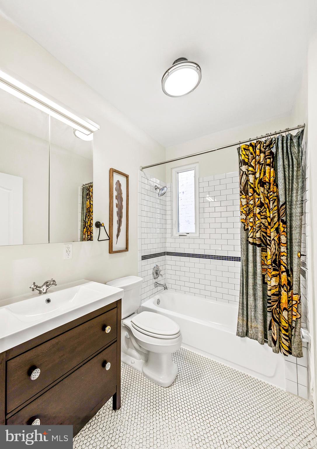 36 Quincy Place Northeast Washington, DC 20002 - Photo 22 of 29 a bathroom with a sink a toilet and shower