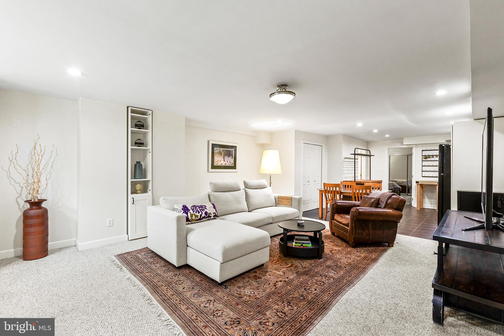 36 Quincy Place Northeast Washington, DC 20002 - Photo 24 of 29 a living room with furniture and a flat screen tv