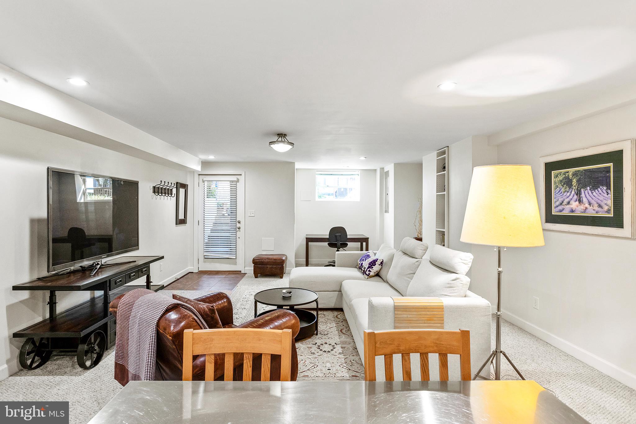 36 Quincy Place Northeast Washington, DC 20002 - Photo 25 of 29 a living room with furniture and a flat screen tv