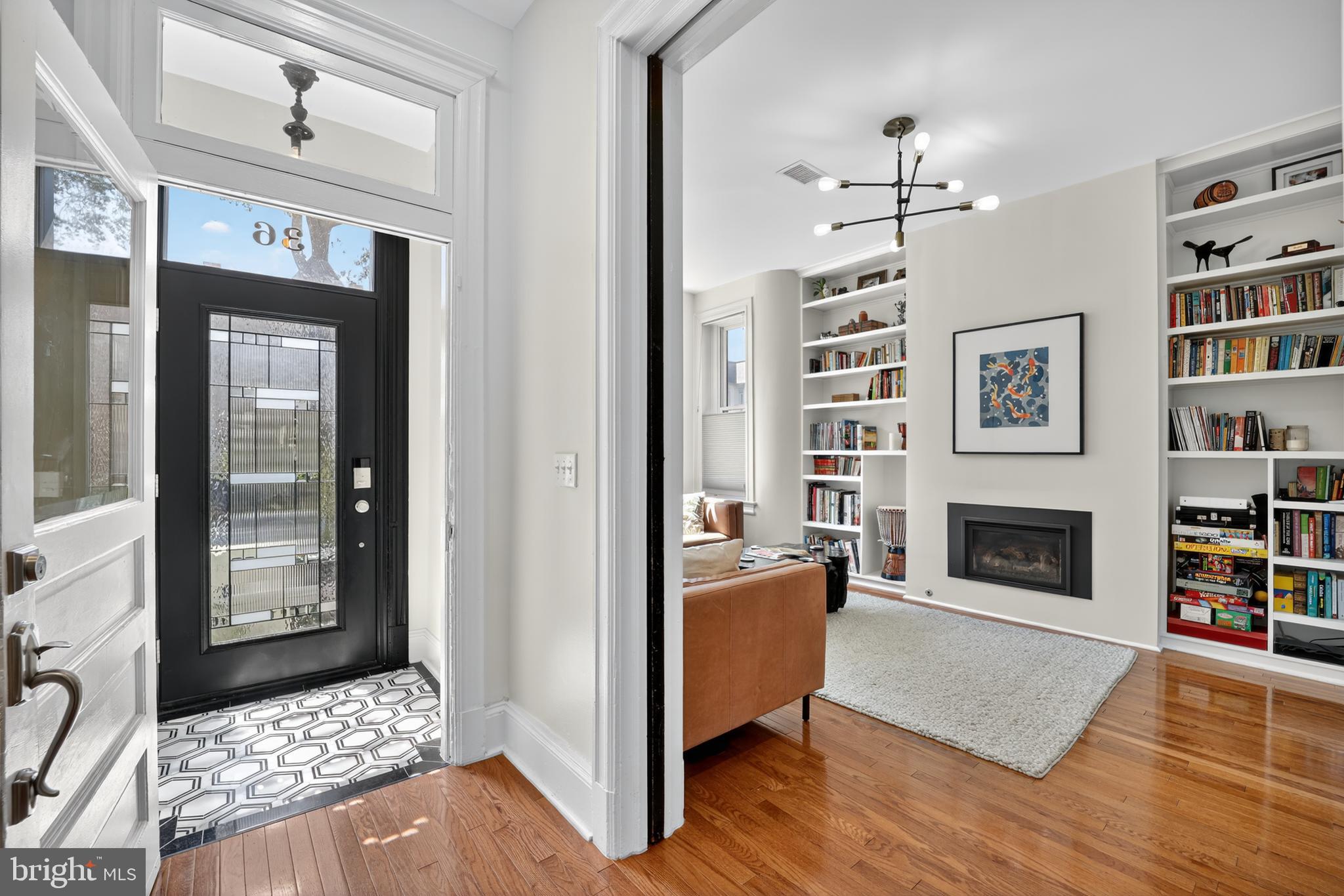 36 Quincy Place Northeast Washington, DC 20002 - Photo 3 of 29 a living room with furniture and a fireplace