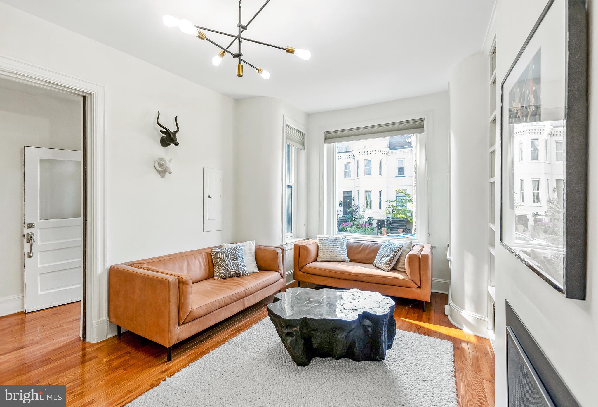 36 Quincy Place Northeast Washington, DC 20002 - Photo 5 of 29 a living room with furniture and a large window