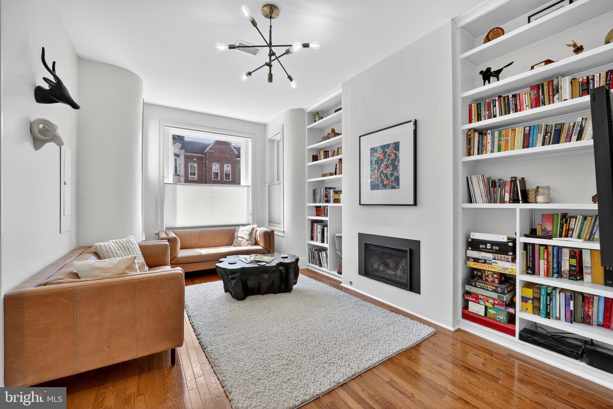 36 Quincy Place Northeast Washington, DC 20002 - Photo 6 of 29 a living room with furniture and a book shelf