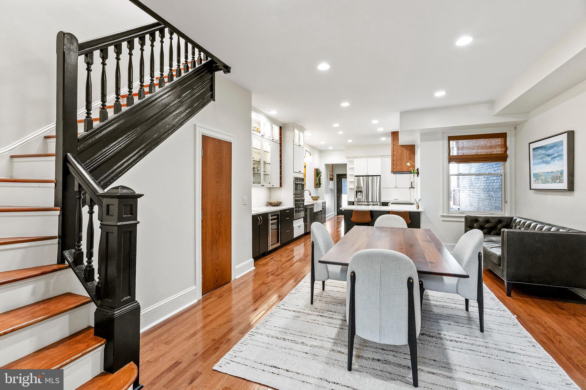 36 Quincy Place Northeast Washington, DC 20002 - Photo 7 of 29 a living room with furniture a fireplace and wooden floor