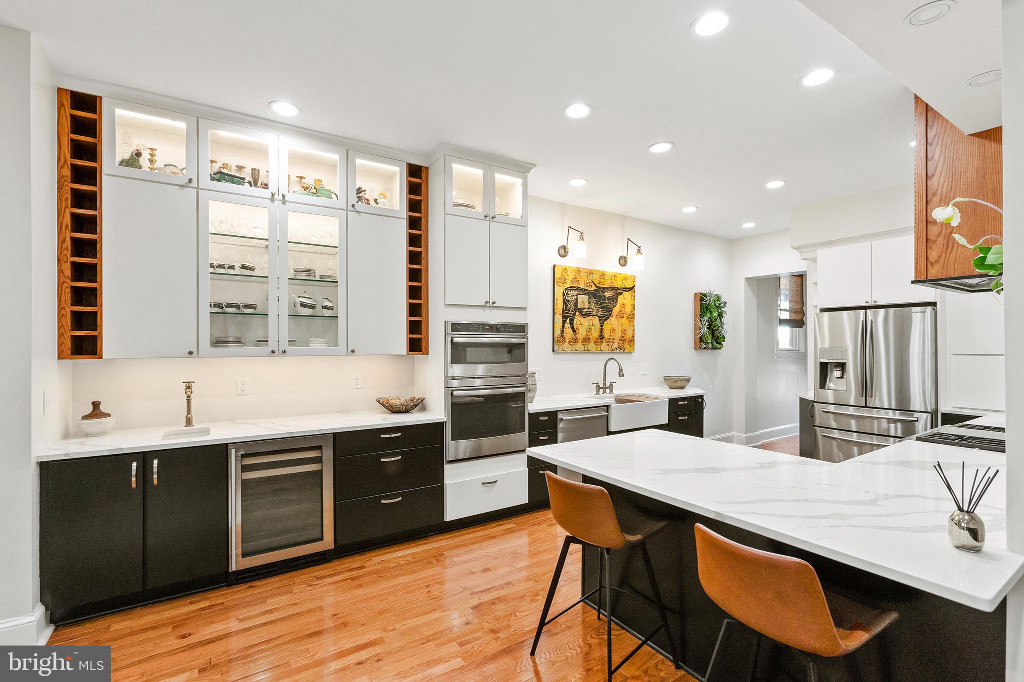 36 Quincy Place Northeast Washington, DC 20002 - Photo 8 of 29 a large kitchen with a table and chairs in it