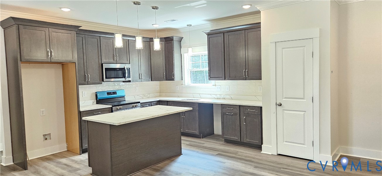 2982 Ashdale Road Center Cross, VA 22437 - Photo 10 of 17 Modern kitchen featuring dark wood-finish cabinetr