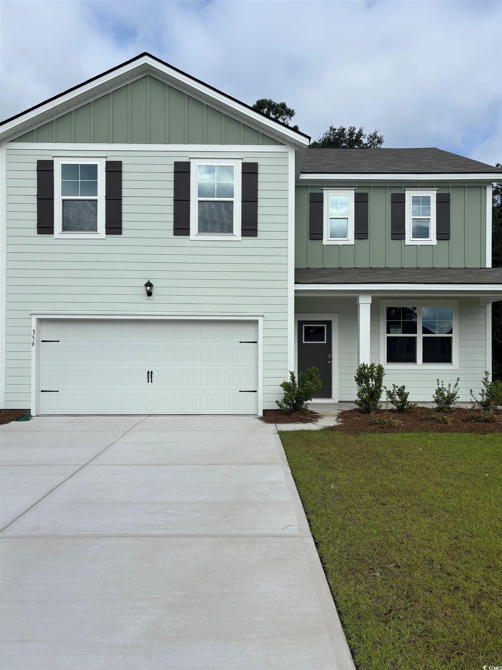 356 Rookroost Circle Conway, SC 29526 - Photo 1 of 27 View of front of house with a garage, covered porc