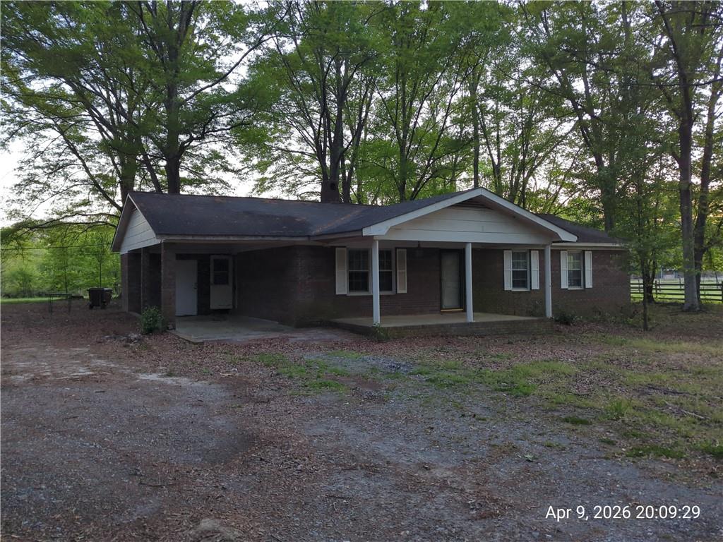 4150 Old Rockmart Road Southeast Silver Creek, GA 30173 - Photo 2 of 15 a front view of a house with a garden