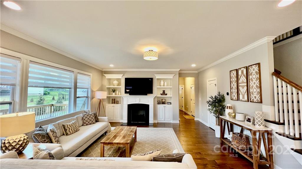 2250 Watermark Point Place, Unit 83 Fort Mill, SC 29708 - Photo 11 of 23 a living room with furniture a fireplace and a flat screen tv