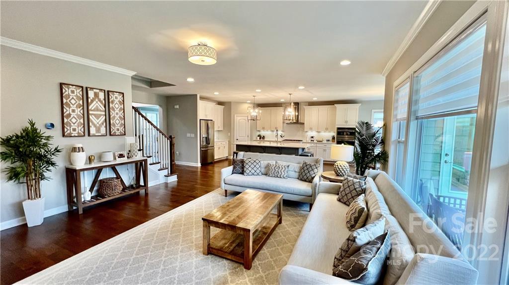 2250 Watermark Point Place, Unit 83 Fort Mill, SC 29708 - Photo 12 of 23 a living room with furniture and a wooden floor
