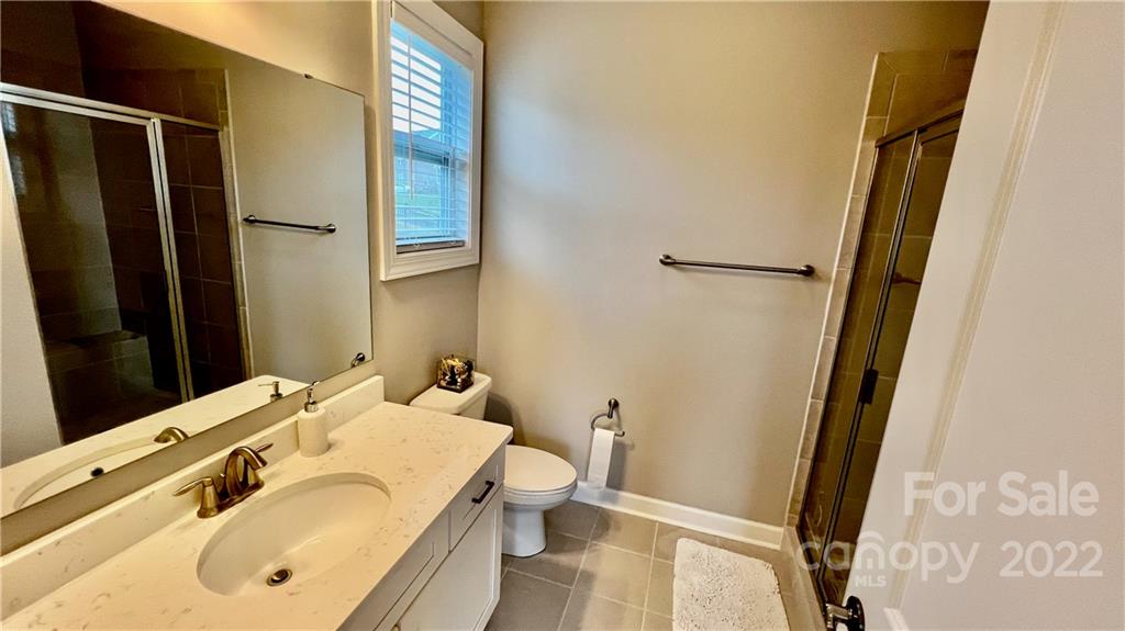 2250 Watermark Point Place, Unit 83 Fort Mill, SC 29708 - Photo 17 of 23 a bathroom with a sink and mirror with toilet