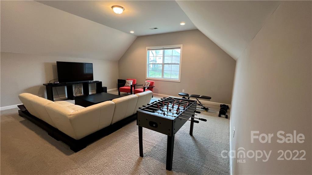 2250 Watermark Point Place, Unit 83 Fort Mill, SC 29708 - Photo 20 of 23 a living room with furniture and a flat screen tv