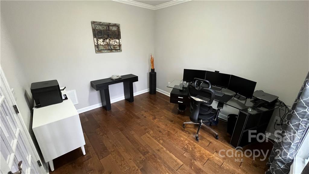 2250 Watermark Point Place, Unit 83 Fort Mill, SC 29708 - Photo 23 of 23 a view of workspace with wooden floor and black wall painting